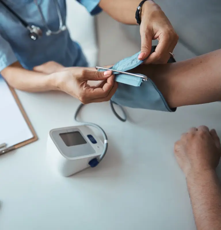 female-doctor-checking-patient-blood-pressure-in-clinic